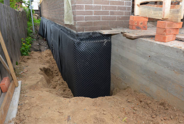 Happy homeowners after waterproofing job in Castile